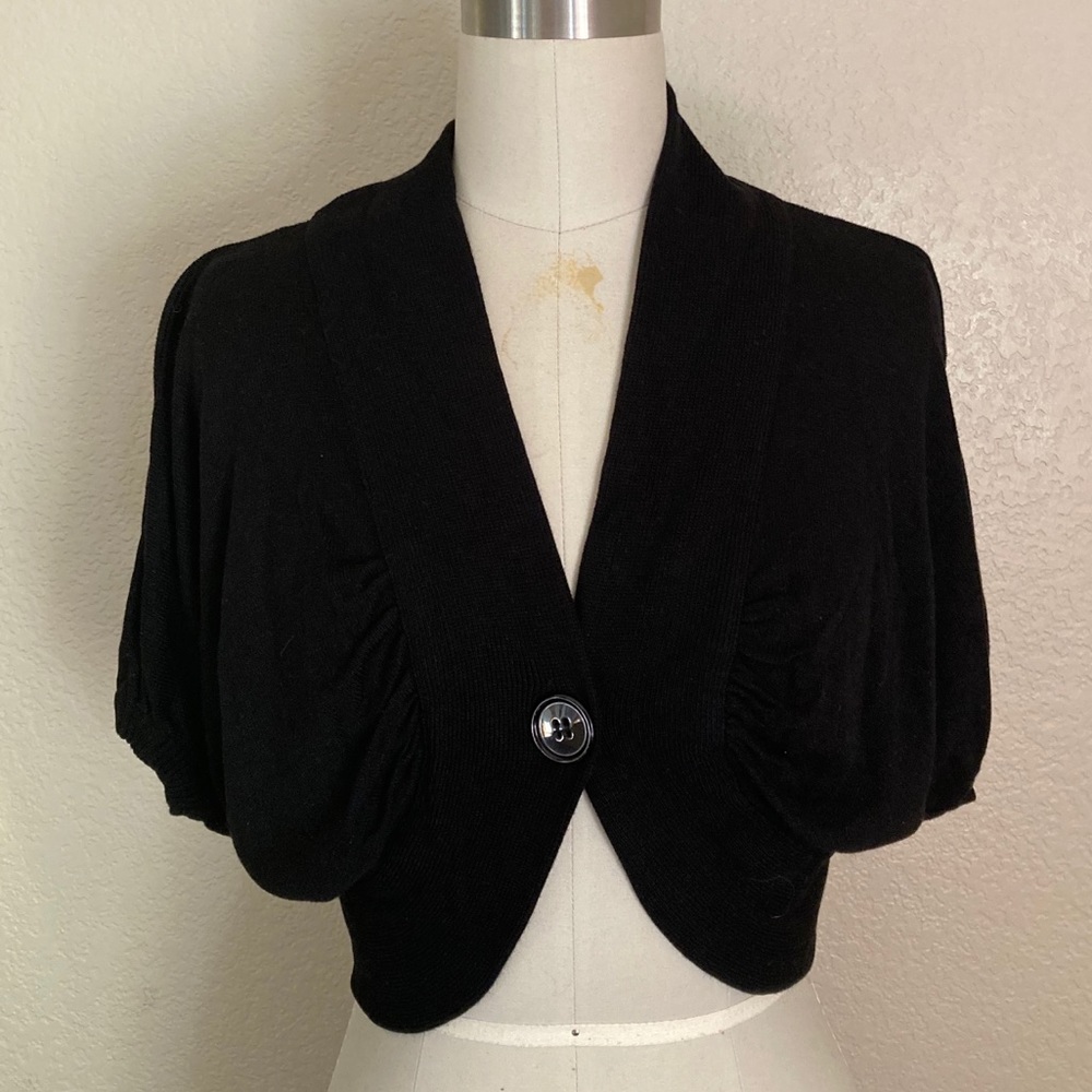 Black Bette Paige v neck with single button.